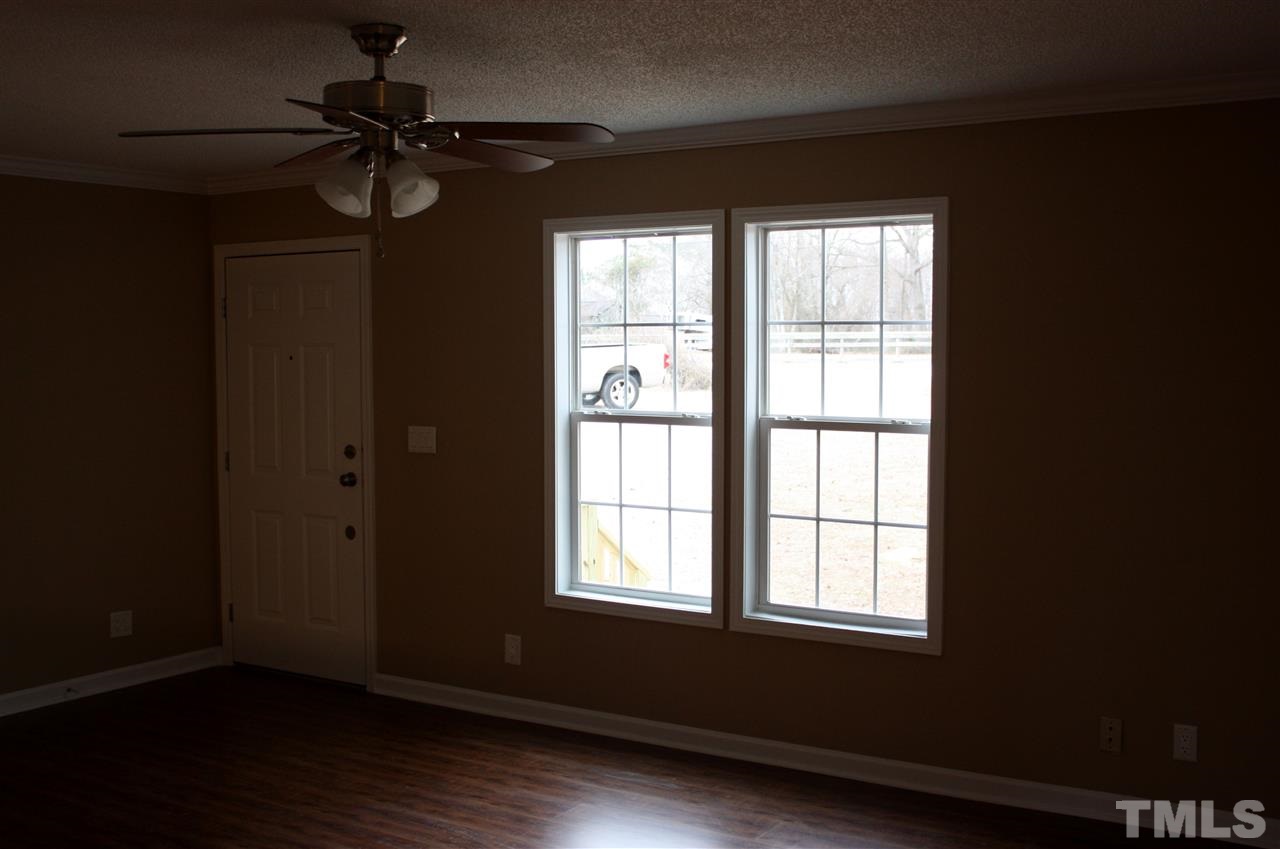1696 Oak Grove Church Road Angier, NC 27501 - Photo 3 of 16 New bamboo wood floors and ceiling fan in living room.