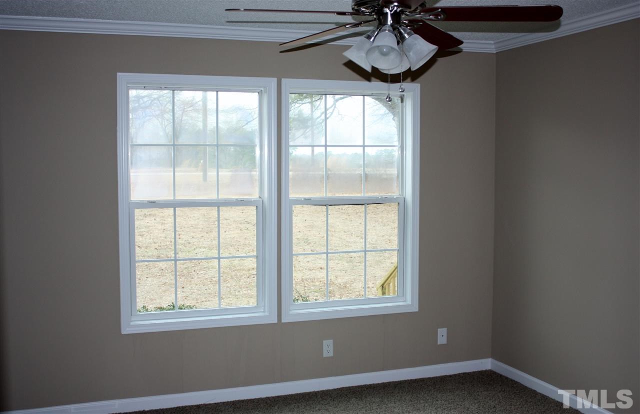 1696 Oak Grove Church Road Angier, NC 27501 - Photo 5 of 16 Master bedroom has new carpet, paint and ceiling fan.