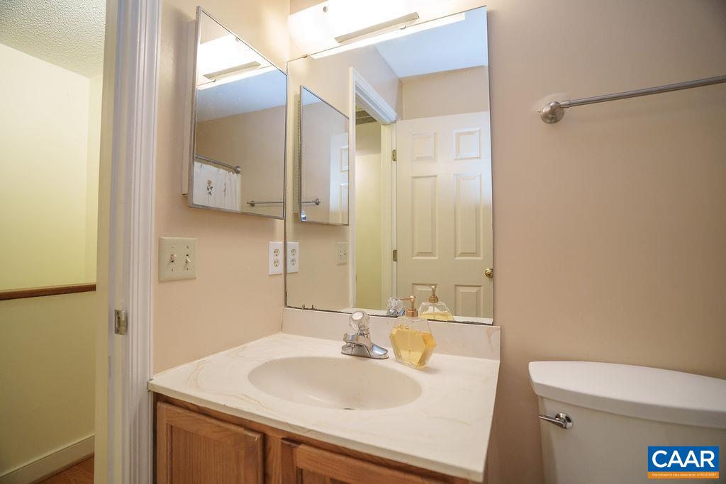 303 Westfield Road Charlottesville, VA 22901 - Photo 34 of 59 a bathroom with a sink toilet and vanity