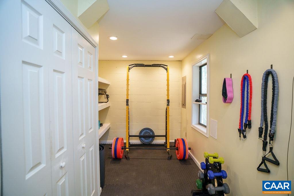 303 Westfield Road Charlottesville, VA 22901 - Photo 42 of 59 a view of walk in closet with clothes and shoes