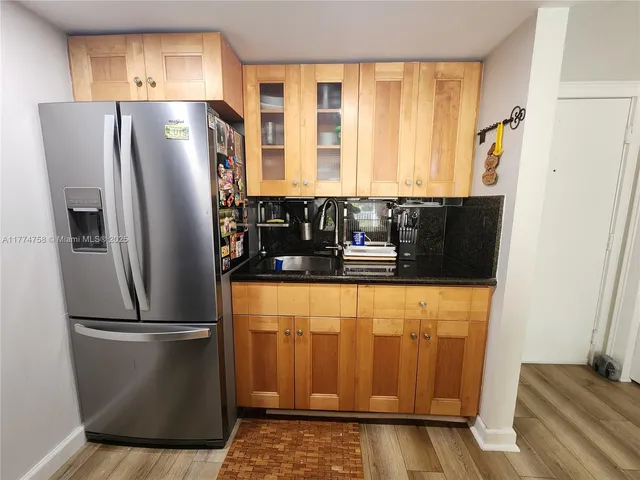 a refrigerator freezer sitting inside of a kitchen