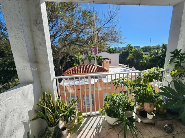 a view of a chairs and table in a patio