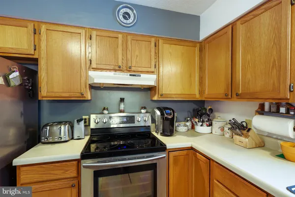 a view of a dining room with furniture and a window