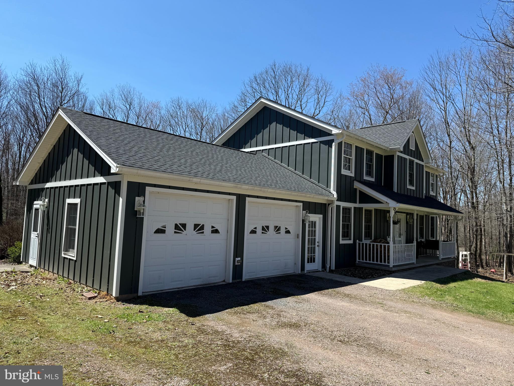 33 Teaberry Ridge Road Lonaconing, MD 21539 - Photo 2 of 101 a front view of a house with a yard and garage