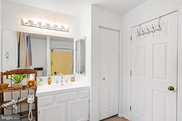 a front view of a house with a yard covered in snow