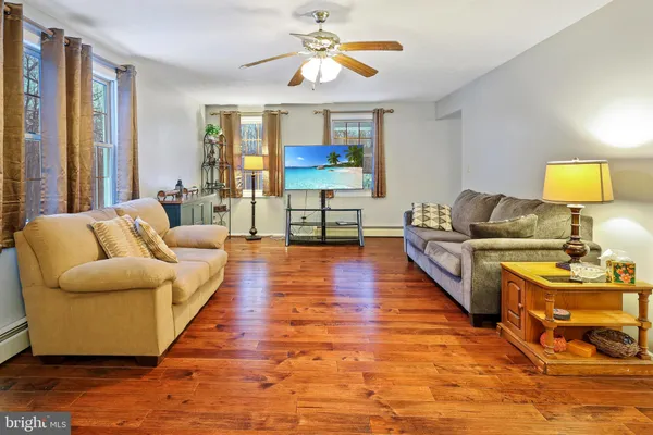 a view of a dining room with furniture and a chandelier