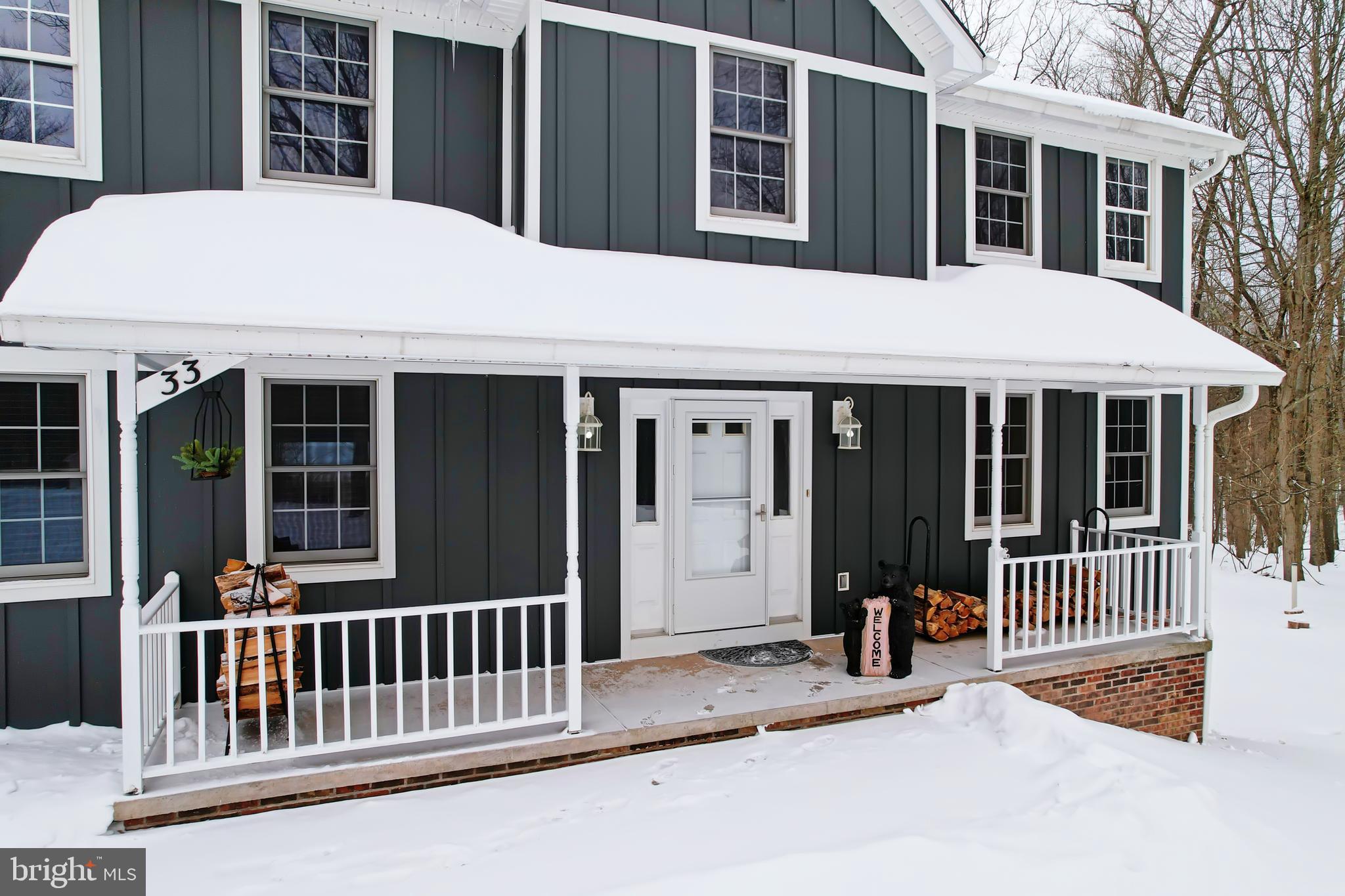 33 Teaberry Ridge Road Lonaconing, MD 21539 - Photo 95 of 101 a front view of a house with a porch