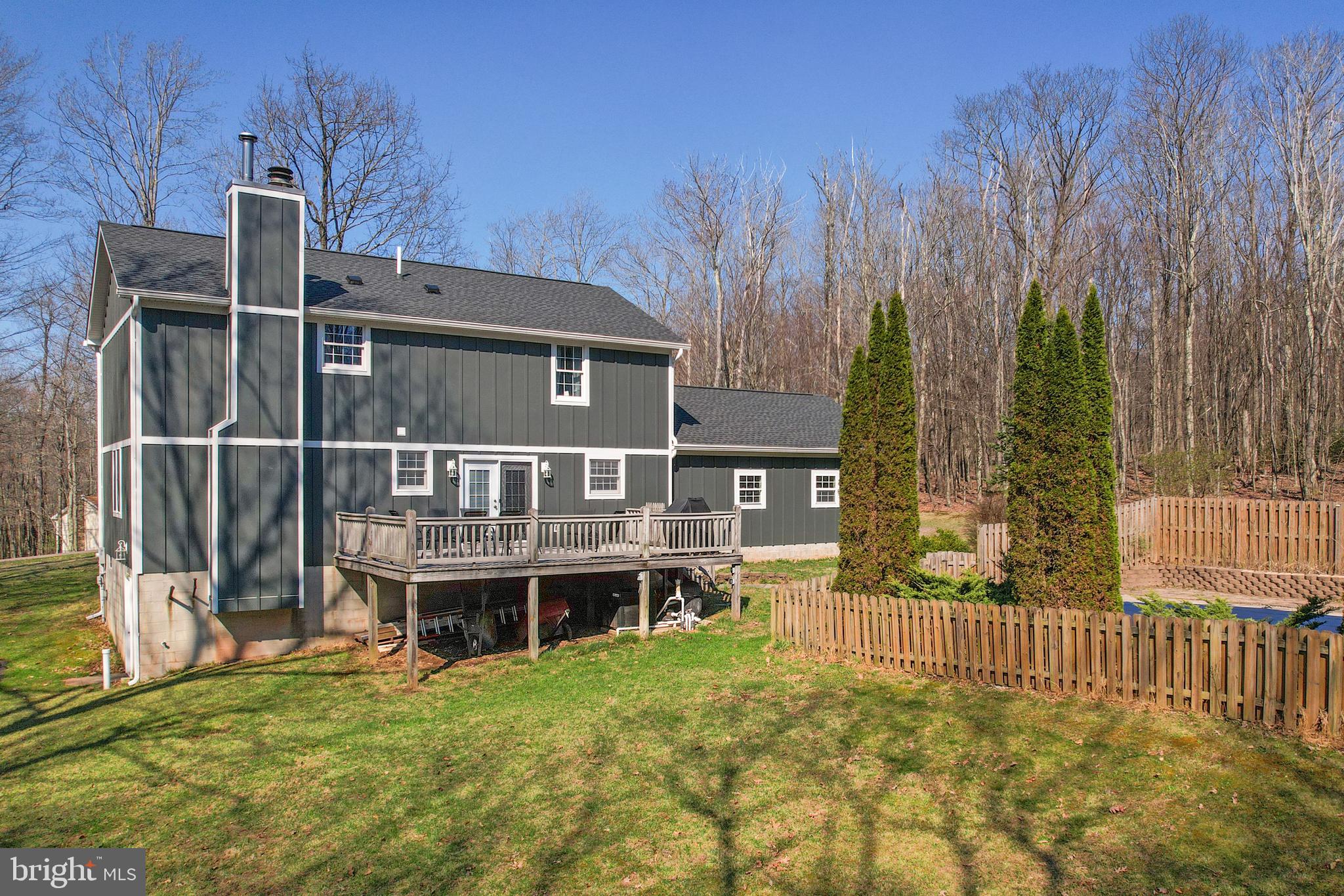 33 Teaberry Ridge Road Lonaconing, MD 21539 - Photo 99 of 101 a view of a house with wooden deck and furniture