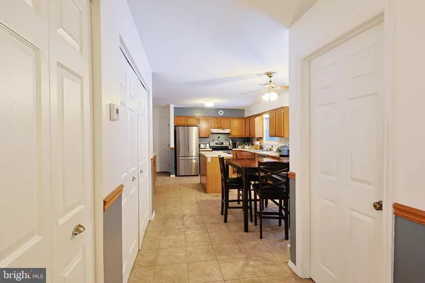 a kitchen with stainless steel appliances a refrigerator sink and cabinets