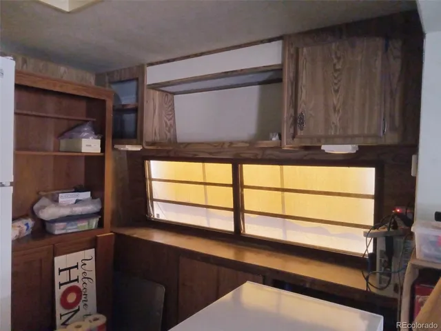 a kitchen with a sink appliances and cabinets
