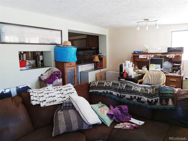 a bedroom with furniture and a wooden floor
