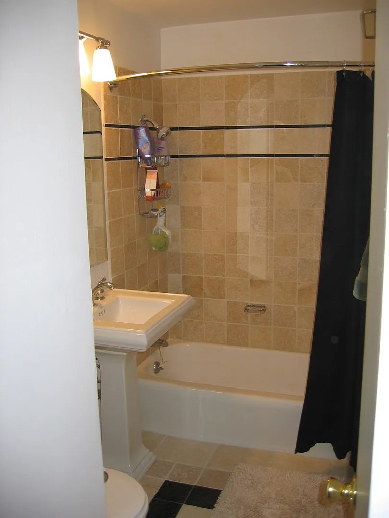 21 West Goethe Street, Unit 11D Chicago, IL 60610 - Photo 5 of 10 a bathroom with a sink and shower