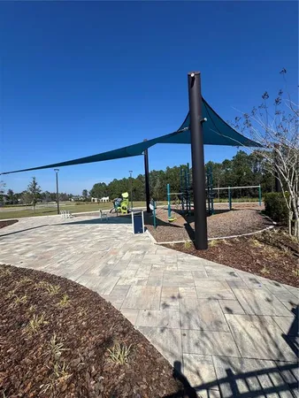 a view of a patio with swimming pool