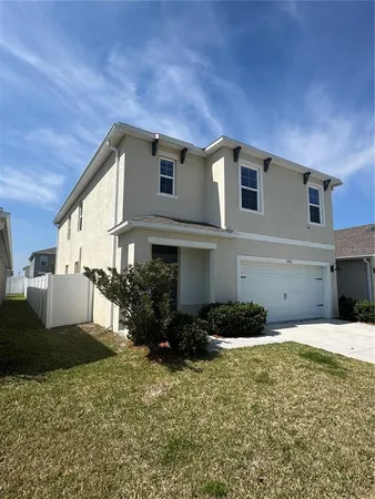 a house view with a backyard space