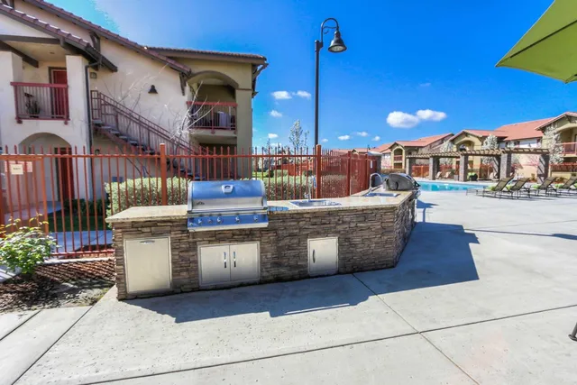a view of a kitchen with outdoor kitchen