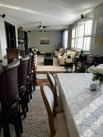 a living room with lots of furniture and a window