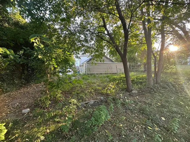 a view of a house with a tree