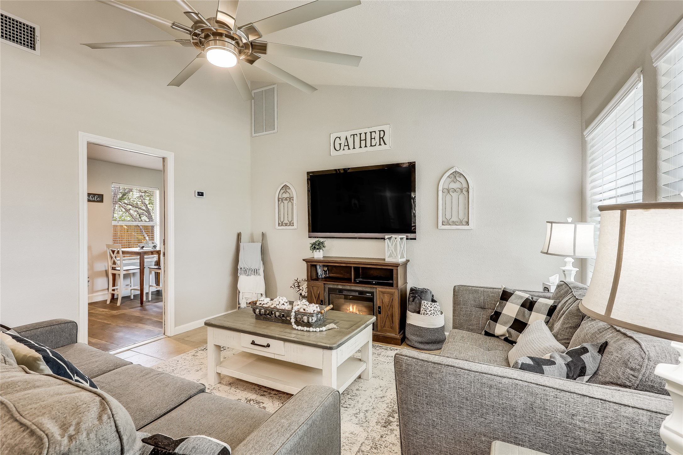 426 Summit Ridge Drive North Point Venture, TX 78645 - Photo 8 of 28 Living room with lofted ceiling and ceiling fan