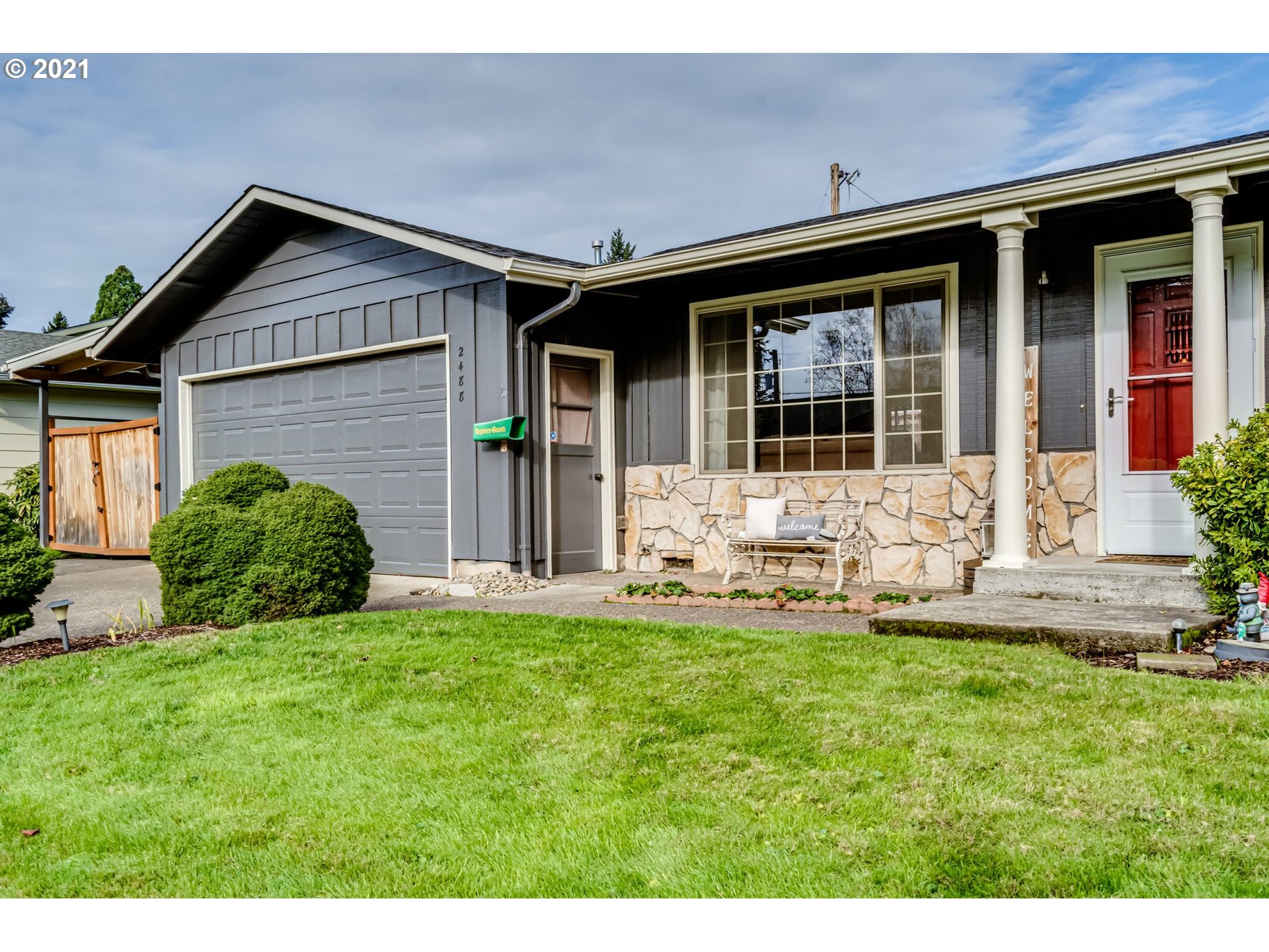 2488 37th Street Springfield, OR 97477 - Photo 3 of 32 a view of a house with a yard and sitting area