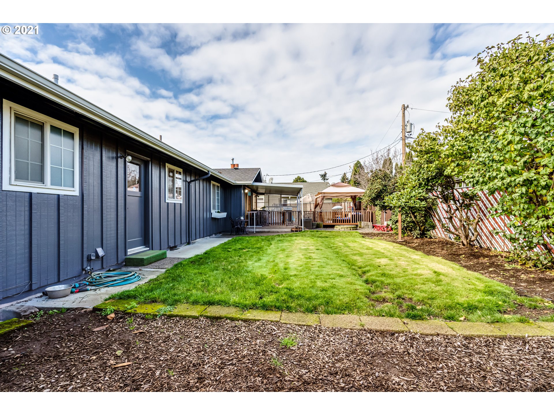 2488 37th Street Springfield, OR 97477 - Photo 29 of 32 a backyard of a house with a garden and outdoor seating