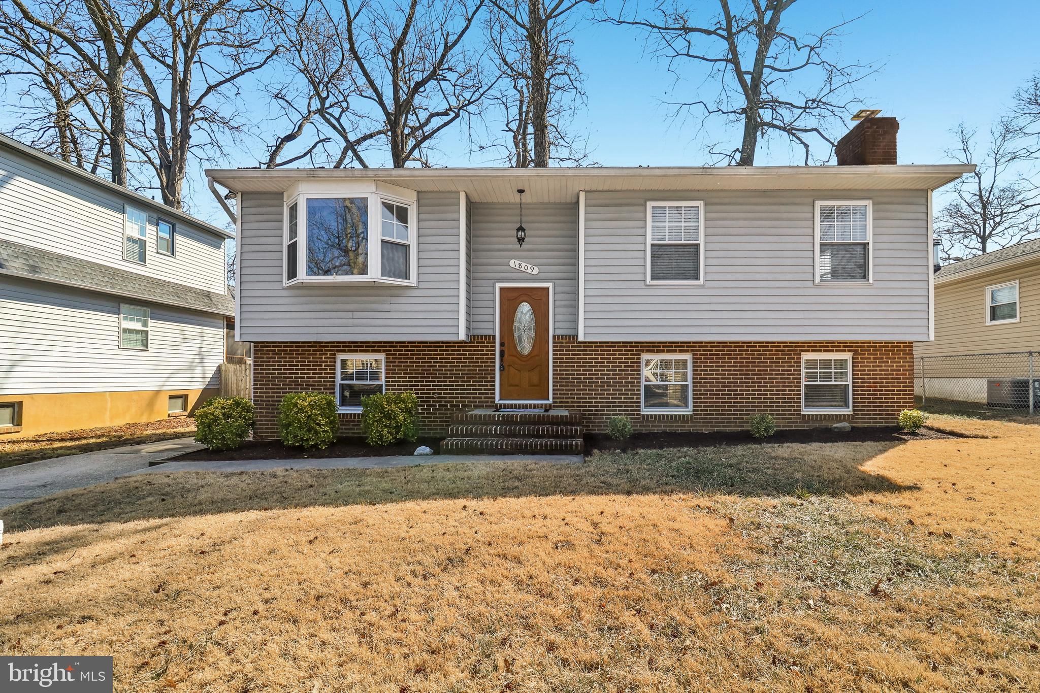 1809 Keymar Road Edgewater, MD 21037 - Photo 1 of 49 a front view of a house with a yard