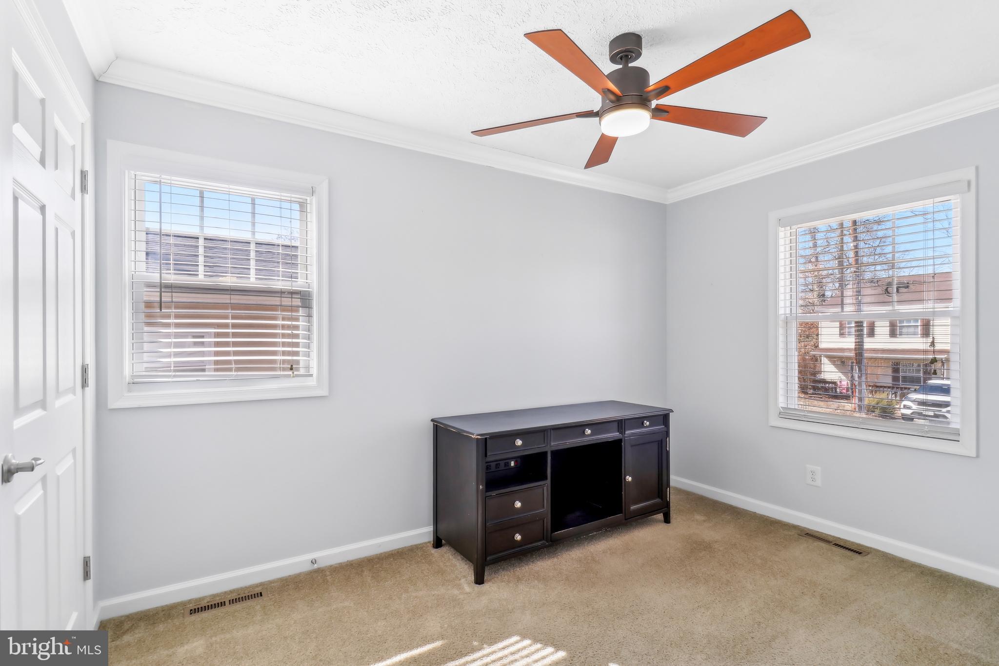 1809 Keymar Road Edgewater, MD 21037 - Photo 12 of 49 an empty room with windows and fan