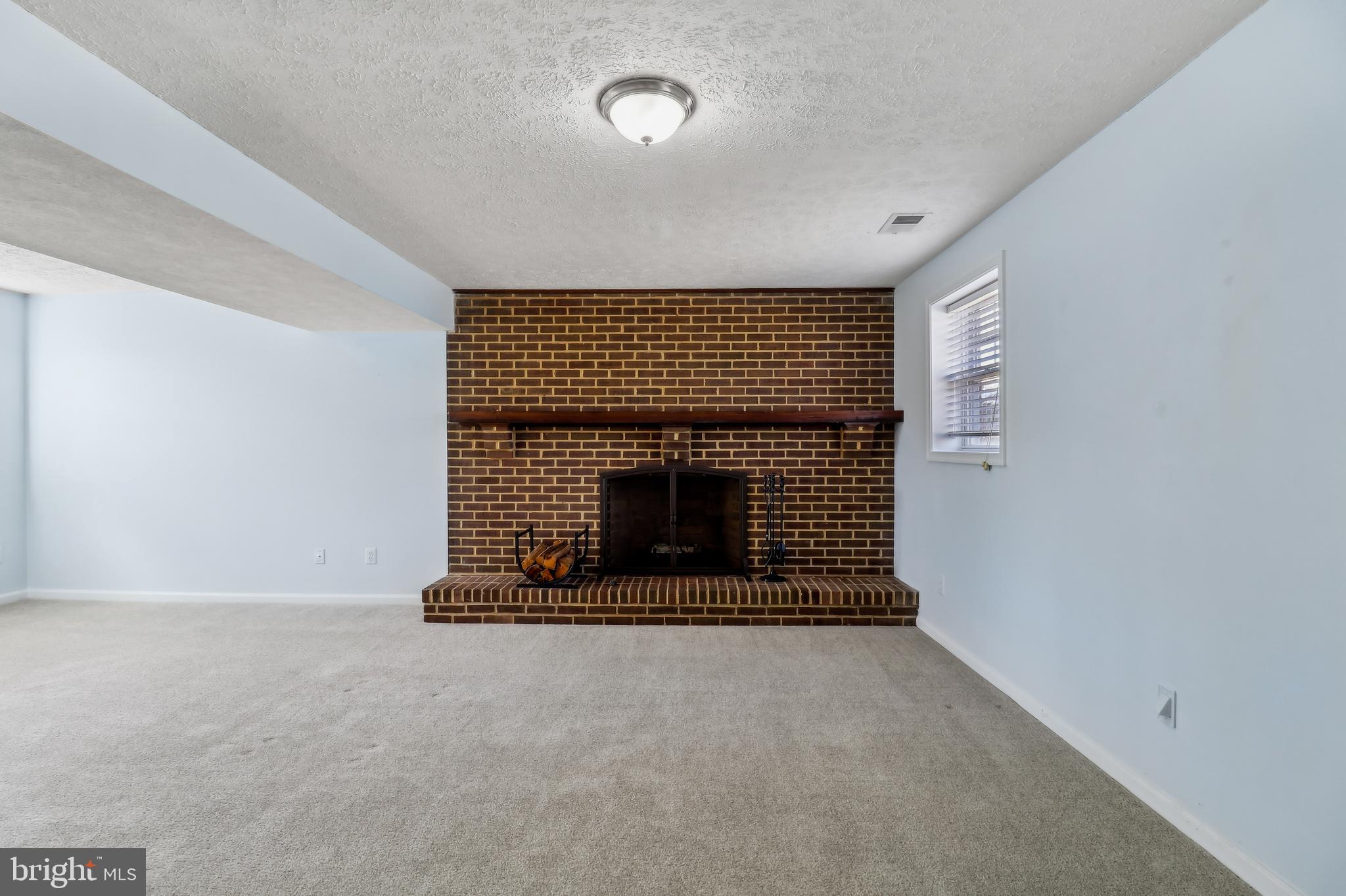 1809 Keymar Road Edgewater, MD 21037 - Photo 20 of 49 an empty room with fireplace