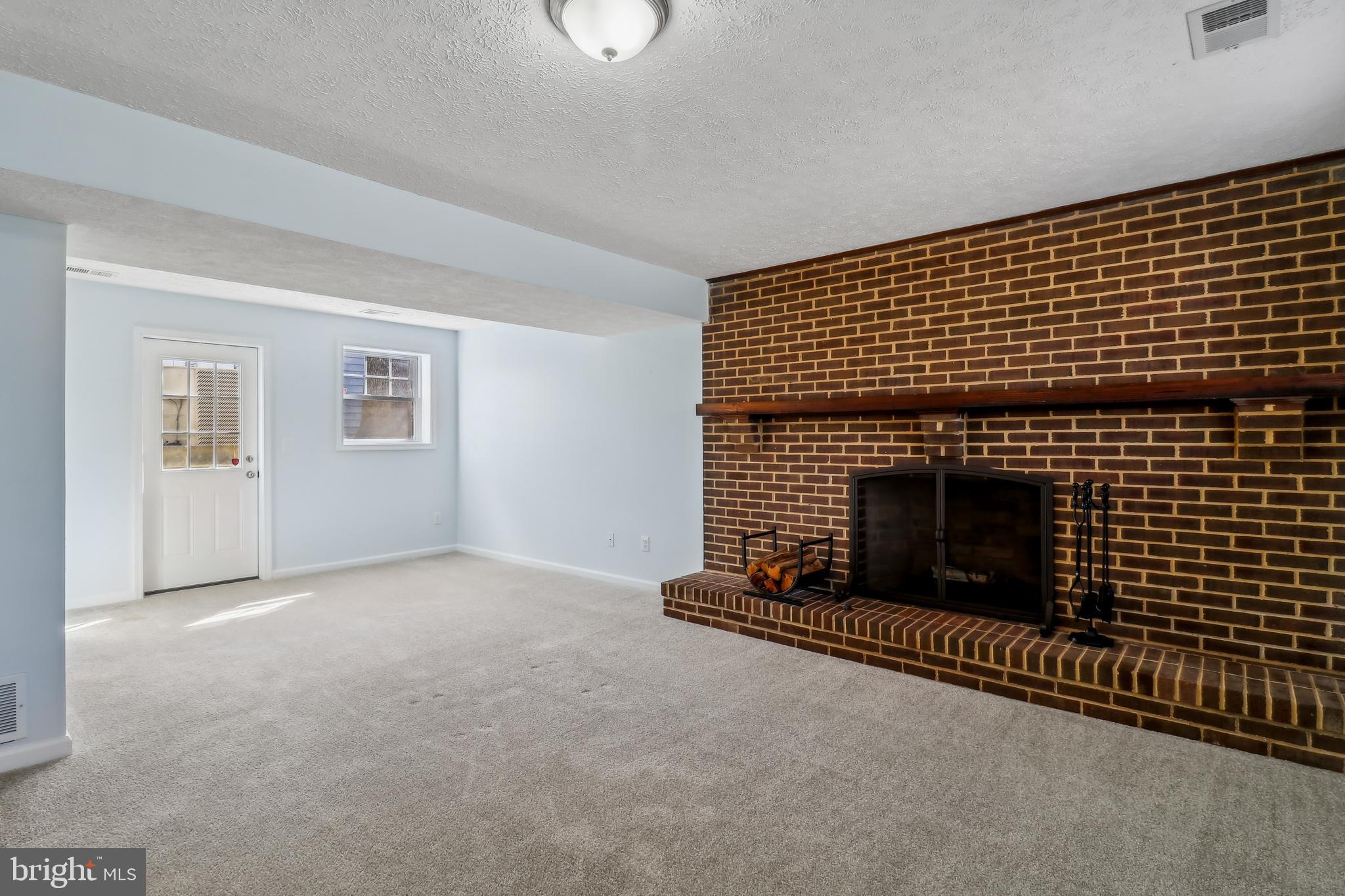 1809 Keymar Road Edgewater, MD 21037 - Photo 21 of 49 a living room with a fireplace