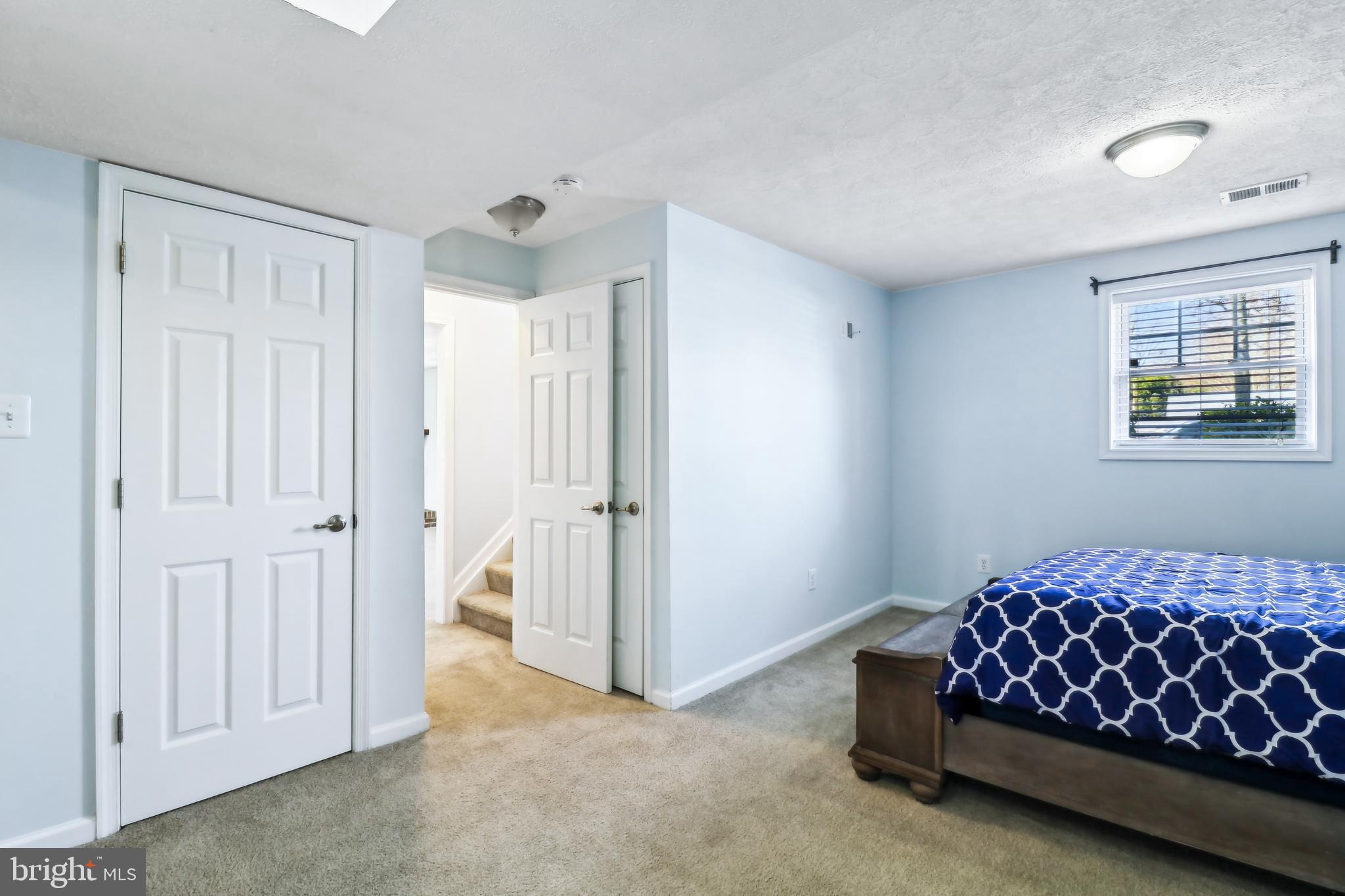 1809 Keymar Road Edgewater, MD 21037 - Photo 27 of 49 a bedroom with a bed and a window