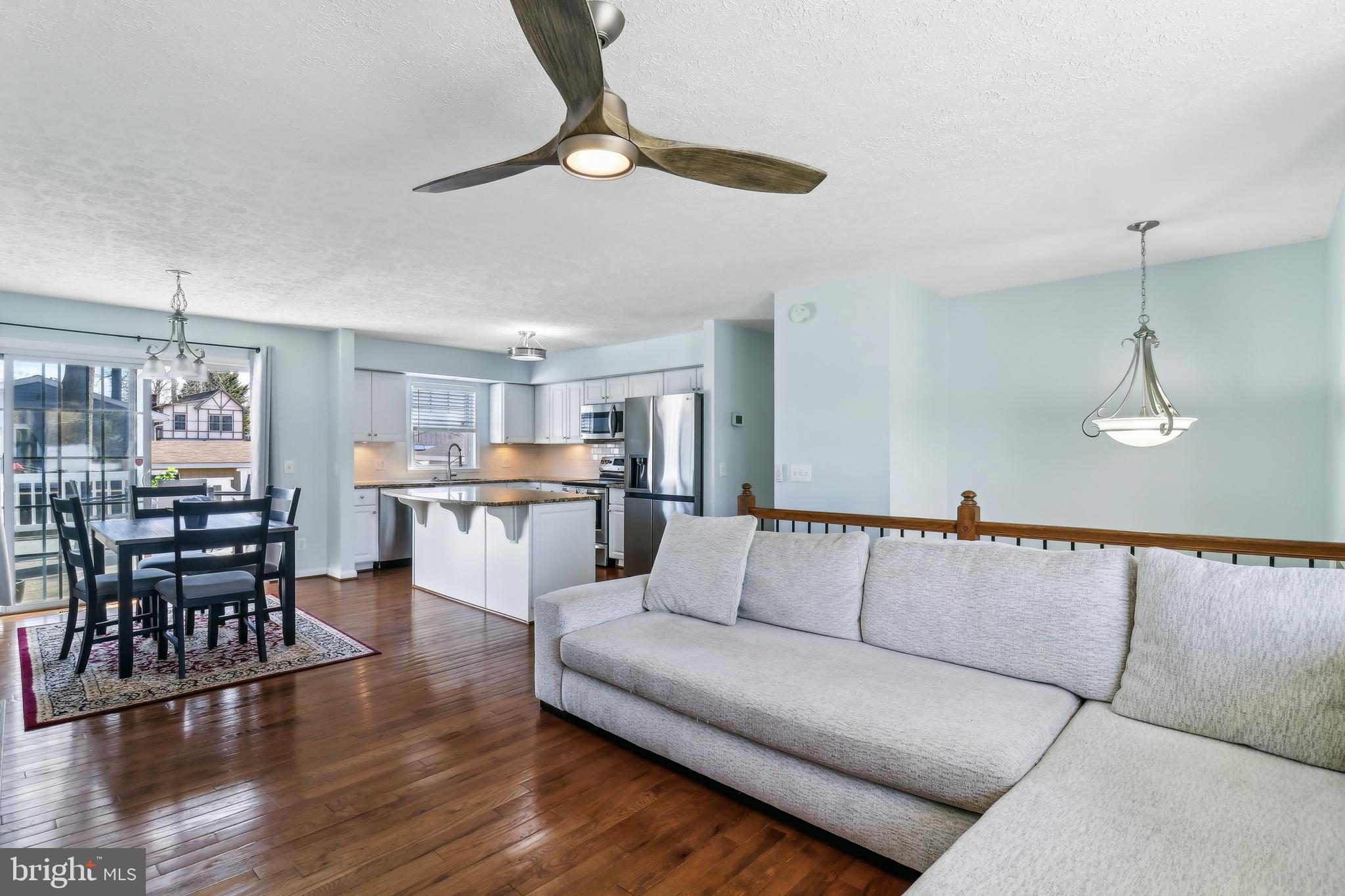1809 Keymar Road Edgewater, MD 21037 - Photo 5 of 49 a living room with furniture kitchen view and a wooden floor