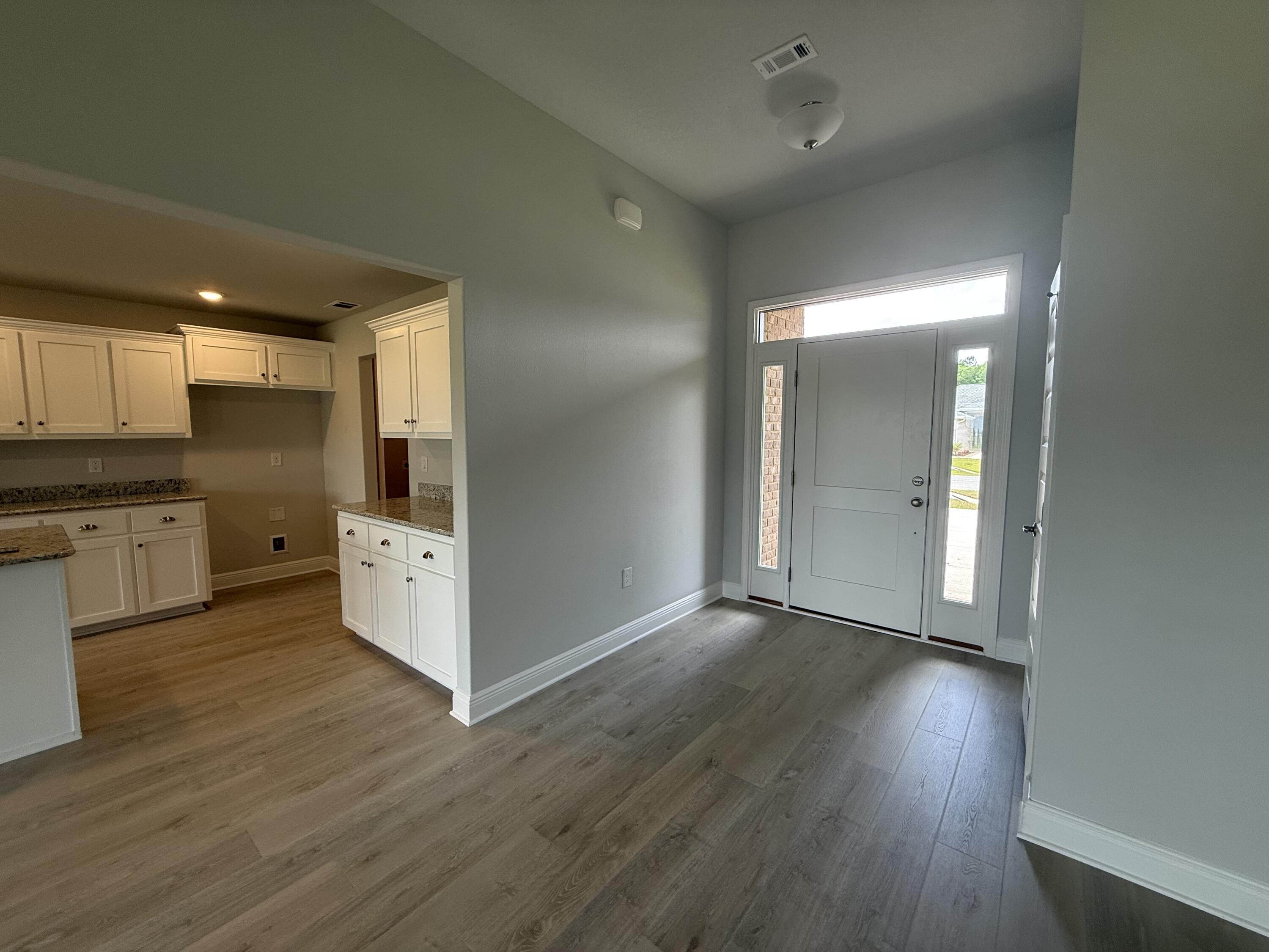 6002 Crocket Cove Crestview, FL 32539 - Photo 6 of 29 a view of kitchen with wooden floor