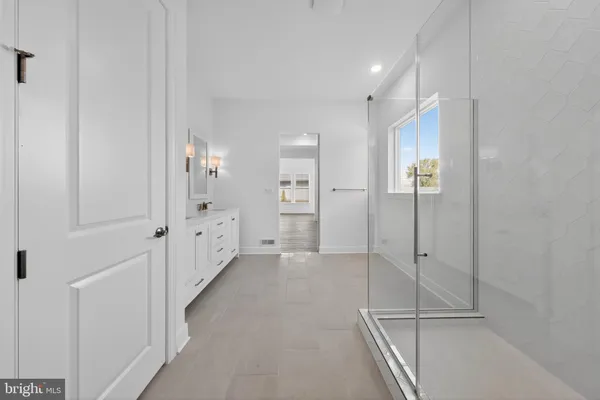 a view of a hallway with white walls