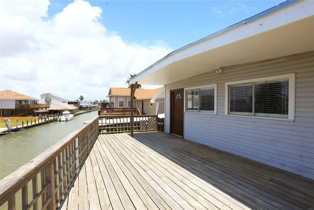 a view of a kitchen with a dishwasher cabinets and a wooden floor