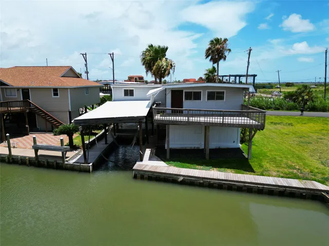 a view of a chairs and table in a swimming pool