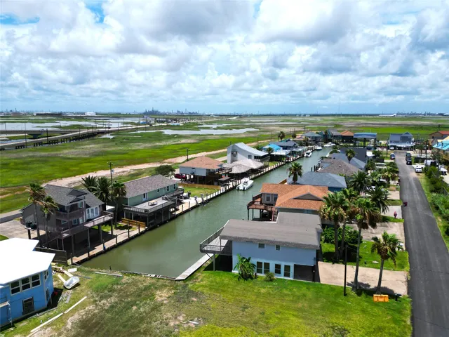 a aerial view of a house with swimming pool and garden