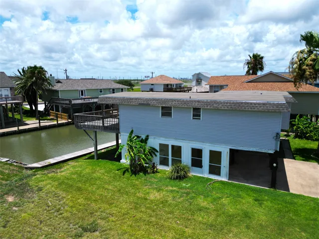 a aerial view of a house with a yard
