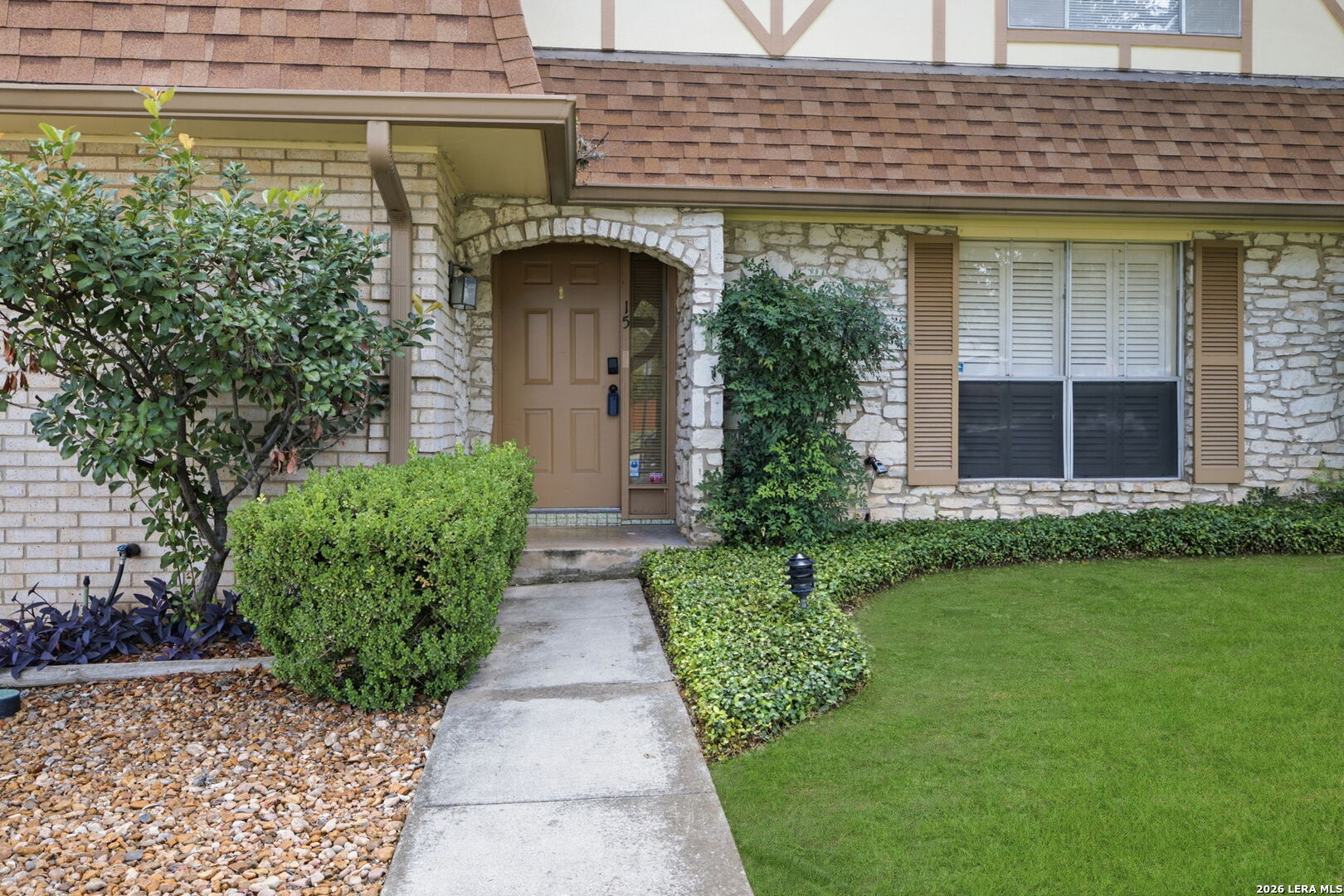 6106 Vance Jackson Road, Unit 15 San Antonio, TX 78230 - Photo 2 of 30 a front view of a house with garden