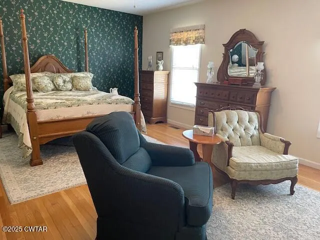 a living room with furniture a rug and a window