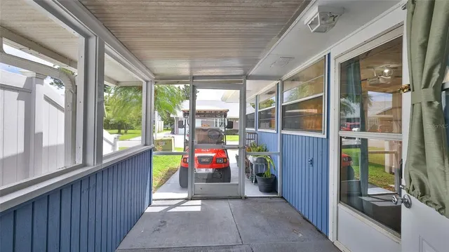 a view of a house with backyard porch and sitting area