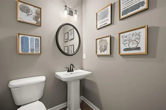 a bathroom with a toilet and a sink