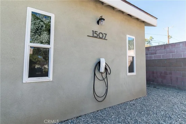 a front view of a house with a yard and a window