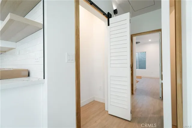 a view of a hallway with closet