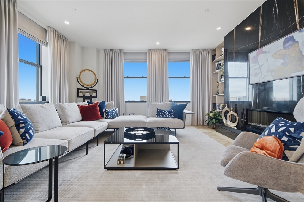 285 Columbus Avenue, Unit PH 805 Boston, MA 02116 - Photo 13 of 42 a living room with furniture and a large window