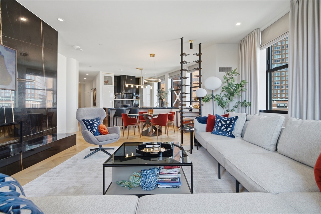 285 Columbus Avenue, Unit PH 805 Boston, MA 02116 - Photo 14 of 42 a living room with furniture and a flat screen tv