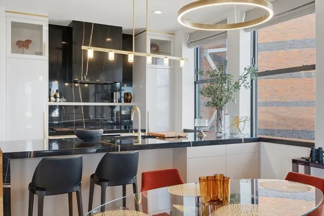 a kitchen with a table and chairs