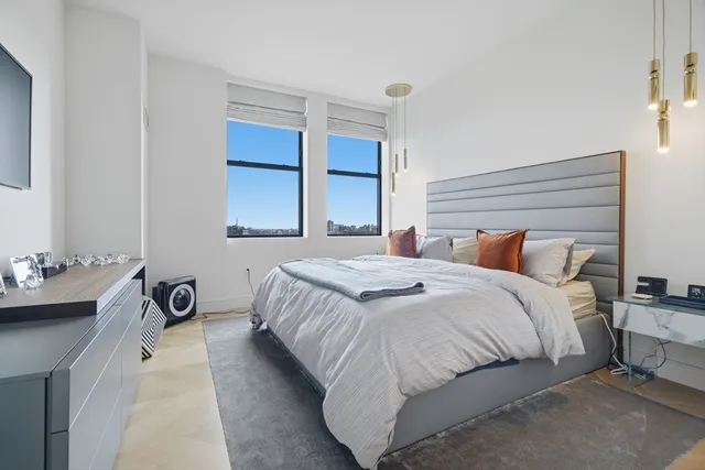 a bedroom with a bed and a cabinets