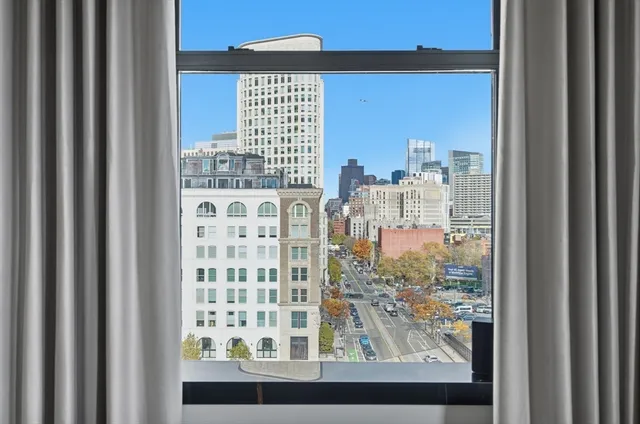 a white bath tub sitting next to a white toilet