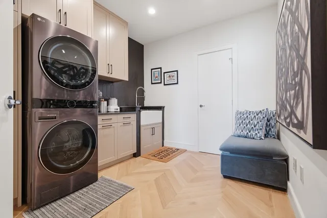 a living room with furniture and a mirror