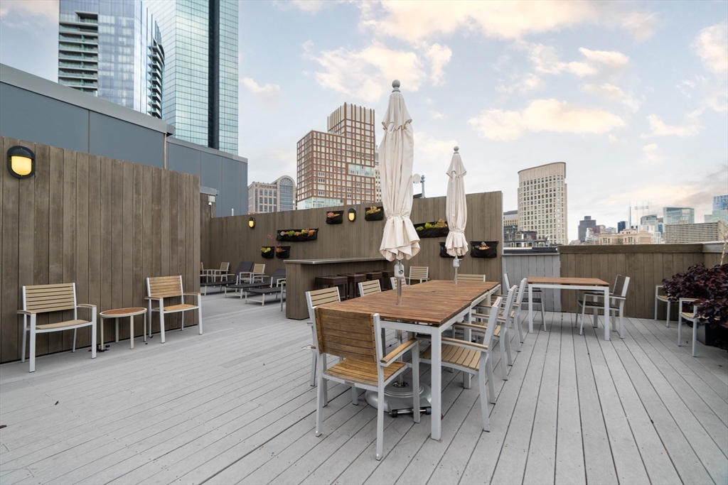 285 Columbus Avenue, Unit PH 805 Boston, MA 02116 - Photo 35 of 42 a view of a roof deck with table and chairs
