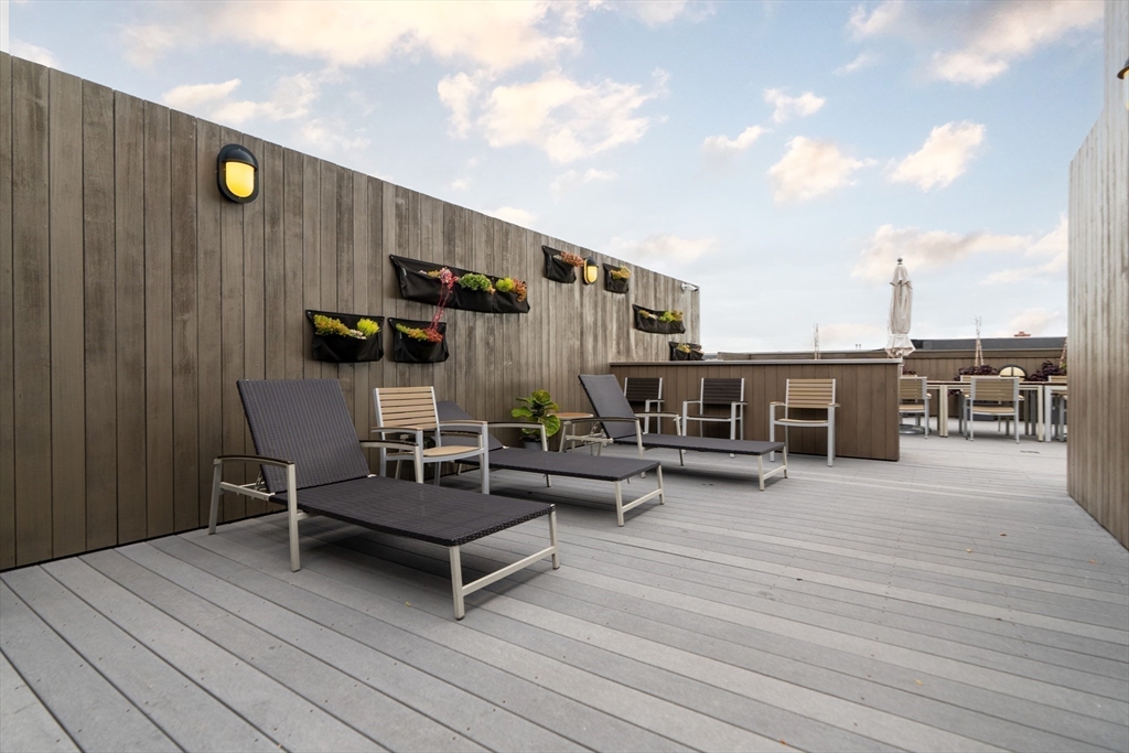 285 Columbus Avenue, Unit PH 805 Boston, MA 02116 - Photo 36 of 42 a roof deck with table and chairs